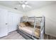 Bunk bed bedroom with wood-look flooring and a closet at 458 Hollinghead Loop, Davenport, FL 33896