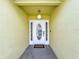 Inviting front entrance with a decorative glass door and neutral siding at 458 Hollinghead Loop, Davenport, FL 33896