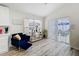 Stylish seating area featuring modern decor, lots of natural light and a comfortable chair at 458 Hollinghead Loop, Davenport, FL 33896