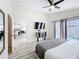 Bright main bedroom features light floors, a ceiling fan and view of the pool at 458 Hollinghead Loop, Davenport, FL 33896
