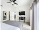 Bright main bedroom features light floors, a ceiling fan, and a closet at 458 Hollinghead Loop, Davenport, FL 33896