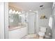 Bright bathroom with a glass-enclosed shower and modern vanity and mirror at 4651 S Atlantic Ave # 2030, Ponce Inlet, FL 32127