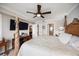Spacious bedroom with a ceiling fan, a flat-screen TV and an ensuite bathroom at 4651 S Atlantic Ave # 2030, Ponce Inlet, FL 32127