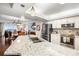 Bright open kitchen features granite counters, stainless appliances, and a breakfast bar that adjoins the dining and living areas at 4651 S Atlantic Ave # 2030, Ponce Inlet, FL 32127