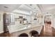 Bright kitchen features granite counters, stainless appliances, and breakfast bar adjoining living areas at 4651 S Atlantic Ave # 2030, Ponce Inlet, FL 32127