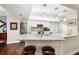 Bright kitchen features granite counters, stainless appliances, and breakfast bar adjoining living areas at 4651 S Atlantic Ave # 2030, Ponce Inlet, FL 32127