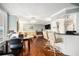 Bright living room featuring hardwood floors, custom window shutters and cozy seating near a convenient bar area at 4651 S Atlantic Ave # 2030, Ponce Inlet, FL 32127