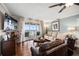 Spacious living room boasts water views, hardwood floors, and comfortable seating at 4651 S Atlantic Ave # 2030, Ponce Inlet, FL 32127