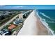 Stunning aerial view of beachfront condos, ocean, and coastline at 4651 S Atlantic Ave # 2030, Ponce Inlet, FL 32127
