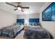 Twin beds, ceiling fan and seaside themed decorations make up this bedroom at 4651 S Atlantic Ave # 2030, Ponce Inlet, FL 32127