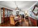 Open dining room with beautiful wood floors and ocean views, connecting to living area at 4651 S Atlantic Ave # 2030, Ponce Inlet, FL 32127