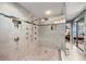 Spa like walk in shower featuring bench and multiple shower heads at 4651 S Atlantic Ave # 2030, Ponce Inlet, FL 32127