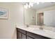 Bright bathroom with double sink vanity and a large mirror at 4841 Romeo Cir, Kissimmee, FL 34746