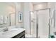 Modern bathroom with walk-in shower, white cabinets, and elegant fixtures at 4841 Romeo Cir, Kissimmee, FL 34746