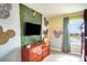 A bedroom with jungle-themed decor at 4841 Romeo Cir, Kissimmee, FL 34746