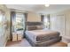 Comfortable bedroom featuring a large bed, bedside tables, and plenty of natural light at 4841 Romeo Cir, Kissimmee, FL 34746
