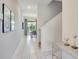 Bright entryway with modern tile flooring and views into the dining area at 4841 Romeo Cir, Kissimmee, FL 34746