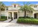 Charming townhome with manicured landscaping and a welcoming covered entrance at 4841 Romeo Cir, Kissimmee, FL 34746