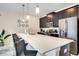 Spacious kitchen featuring an extended island with seating and modern stainless steel appliances at 4841 Romeo Cir, Kissimmee, FL 34746