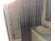 Functional bathroom featuring a shower, sink, and vanity at 50989 Highway 27 # 130, Davenport, FL 33897