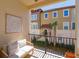 Cozy balcony with outdoor seating and views of the community and palm tree at 528 Lobelia Dr, Lake Mary, FL 32746