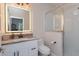 Bright bathroom featuring a modern vanity with marble countertop and a glass-enclosed walk-in shower at 528 Lobelia Dr, Lake Mary, FL 32746