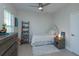 Cozy bedroom with a ceiling fan, a twin bed, and a soft rug at 528 Lobelia Dr, Lake Mary, FL 32746