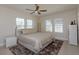 Bright bedroom featuring a neutral color scheme, ceiling fan, and plenty of natural light at 528 Lobelia Dr, Lake Mary, FL 32746