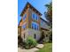 Elegant multi-story home with beautiful architectural details and lush landscaping at 528 Lobelia Dr, Lake Mary, FL 32746