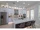 Modern kitchen featuring a large marble island, stainless steel appliances, and white cabinetry at 528 Lobelia Dr, Lake Mary, FL 32746