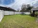 Expansive backyard with a swing set and white privacy fence at 536 Dunoon St, Ocoee, FL 34761