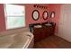 Bathroom featuring a soaking tub with a window and double sinks with vanity space at 536 Dunoon St, Ocoee, FL 34761