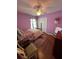 Bedroom featuring hardwood floors, ceiling fan, and closet with double doors at 536 Dunoon St, Ocoee, FL 34761