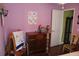 Bedroom featuring hardwood floors, a dresser, and a wooden chair at 536 Dunoon St, Ocoee, FL 34761