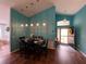 Inviting dining room with a wooden table and dark wooden floors at 536 Dunoon St, Ocoee, FL 34761