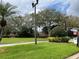 Sign at community entrance with well-maintained landscaping and beautiful trees at 536 Dunoon St, Ocoee, FL 34761