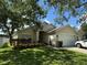 Charming one-story home with a well-maintained lawn and lush landscaping in a tranquil setting at 536 Dunoon St, Ocoee, FL 34761