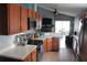 Well-equipped kitchen with stainless appliances, quartz counters, and stylish cabinetry at 536 Dunoon St, Ocoee, FL 34761