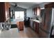 Kitchen featuring stainless steel refrigerator, ample countertops, and view to living room at 536 Dunoon St, Ocoee, FL 34761