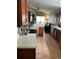 Bright kitchen features stainless steel appliances, wood cabinetry, and tiled floor at 536 Dunoon St, Ocoee, FL 34761