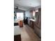 Bright kitchen features stainless steel appliances, wood cabinetry, and tiled floor at 536 Dunoon St, Ocoee, FL 34761