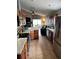 Bright kitchen features stainless steel appliances, wood cabinetry, and tiled floor at 536 Dunoon St, Ocoee, FL 34761