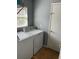 Practical laundry area with a white washer and dryer setup at 536 Dunoon St, Ocoee, FL 34761