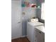Functional laundry room with washer, dryer, and storage shelving at 536 Dunoon St, Ocoee, FL 34761