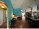 Spacious living room with wood flooring, and a seamless flow to the dining area at 536 Dunoon St, Ocoee, FL 34761