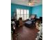 Office with hardwood floors, a ceiling fan, and blue walls at 536 Dunoon St, Ocoee, FL 34761