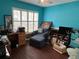 Office with hardwood floors, large windows, and blue walls at 536 Dunoon St, Ocoee, FL 34761