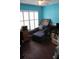 Office with hardwood floors, a ceiling fan, and blue walls at 536 Dunoon St, Ocoee, FL 34761