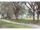 Community park with a playground, walking path and a lake in the background at 536 Dunoon St, Ocoee, FL 34761
