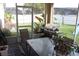 Enclosed patio features a barbecue grill, and view of backyard at 536 Dunoon St, Ocoee, FL 34761